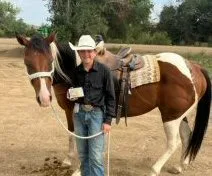 Jhett Hauk with his paint horse Cisco